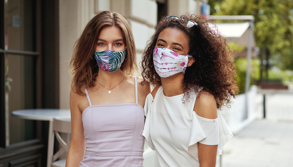 Female couple wearing face masks on a street